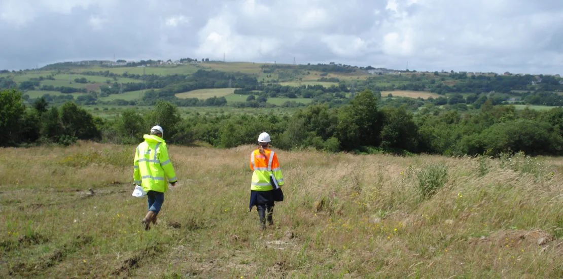 Ecologist appraising a site with a grass snake
